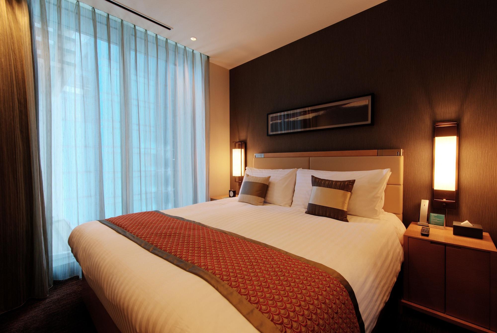 Oakwood Premier Tokyo Hotell Eksteriør bilde A bedroom in a hotel